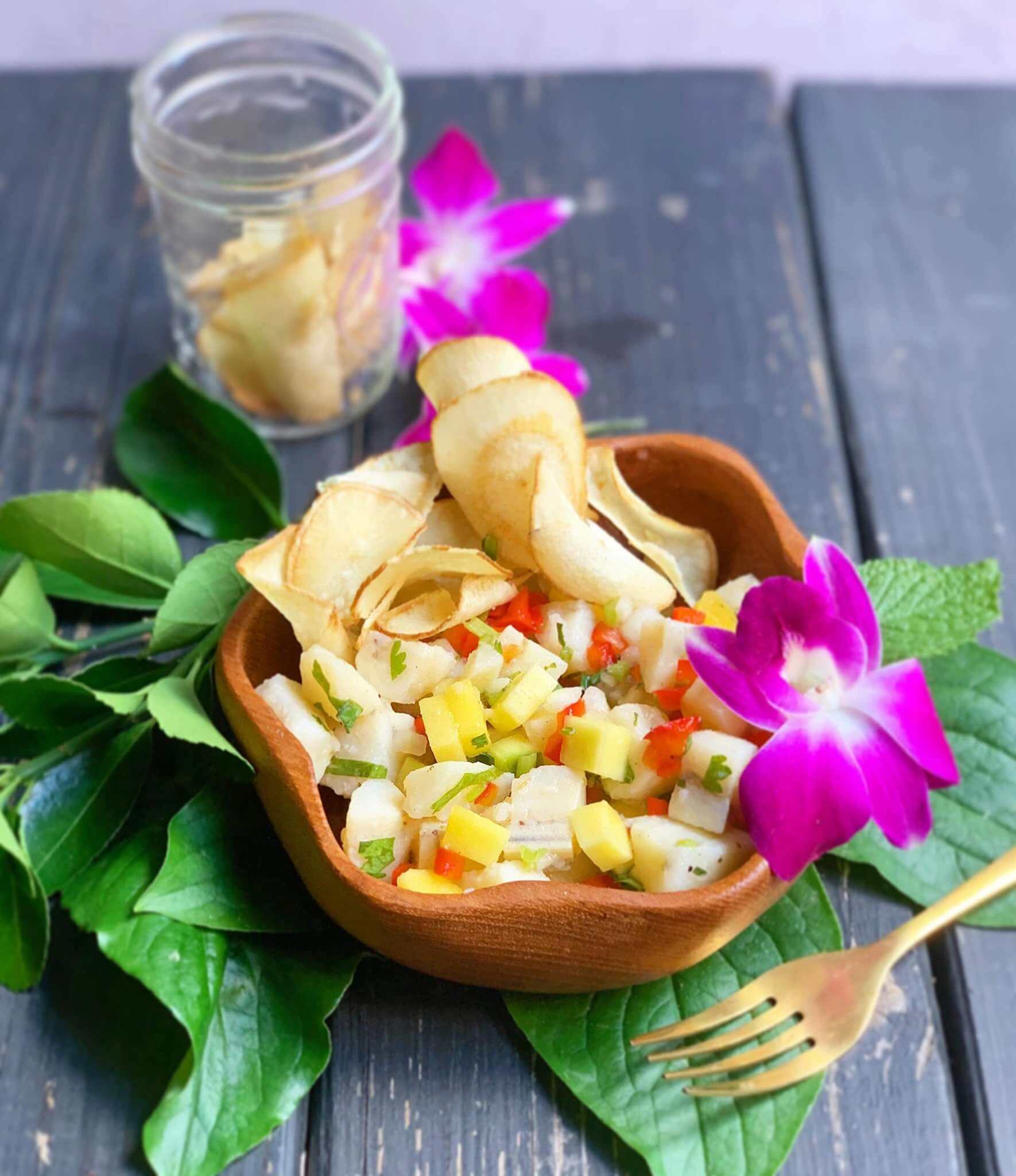 Hawaiian pineapple salsa in a bowl, topped with chips